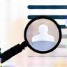 Magnifying glass scanning a profile illustration